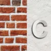 Wiltec Hausnummer c silberfarbene Edelstahl Hausnummer in modernem 3D-Design, Höhe 15 cm, Schrift Arial, rostfrei und witterungsbeständig, mit Montagematerial